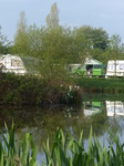 FZ029009 Campervan reflected in pond.jpg